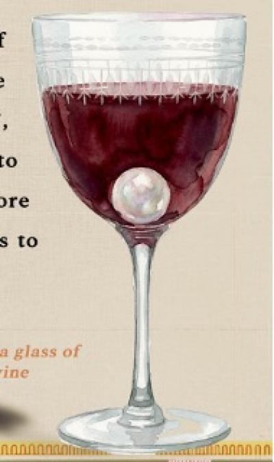 Glass of red wine with a pearl within - Cleopatra Immersive Exhibition